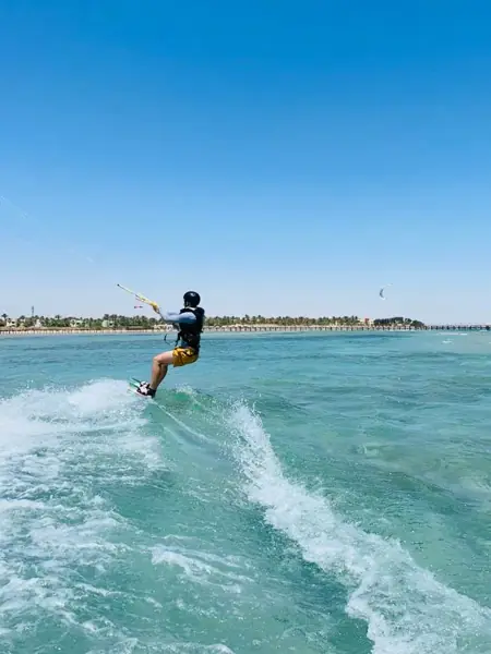 Kiteboarding over turquoise water