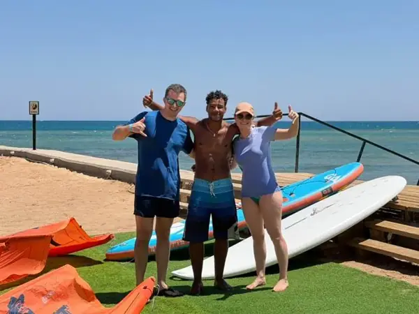 Guests with their instructor and SUP boards
