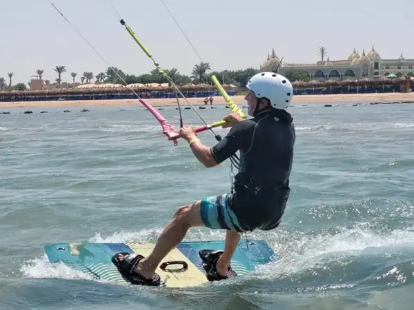 Kitesurfer with a white helmet riding on the Red Sea