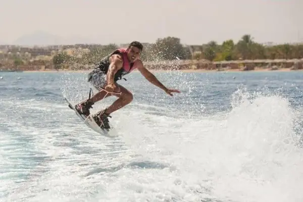 Wakeboarder jumping on the wake
